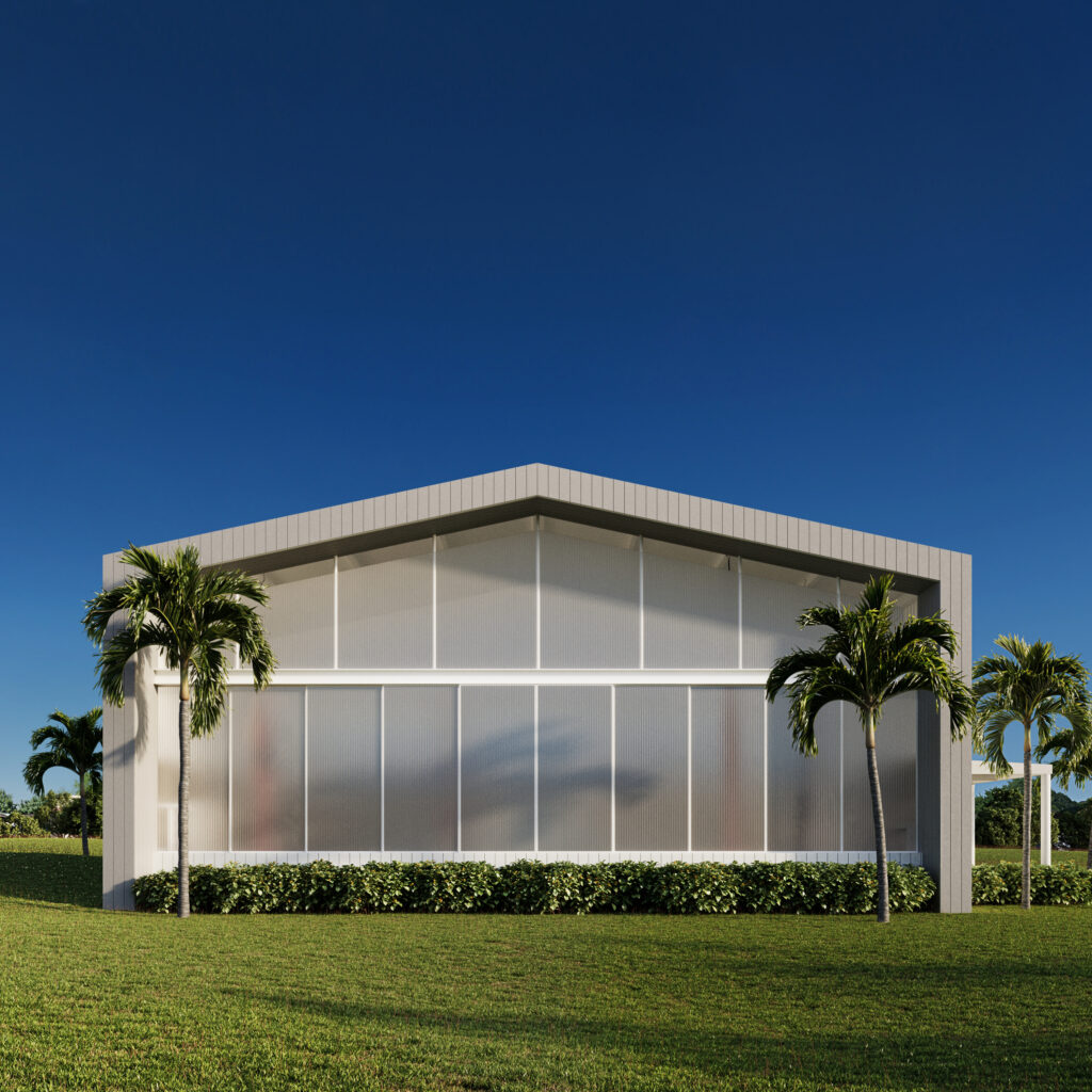 Contemporary building with metal siding, translucent panels, and palm trees against a blue sky, Guayaquil.