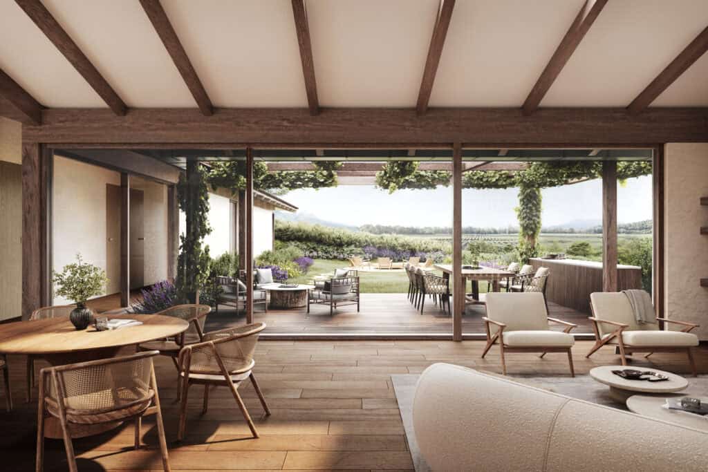 Living space featuring wooden beams, large glass doors leading to a patio with vineyard views, Portugal